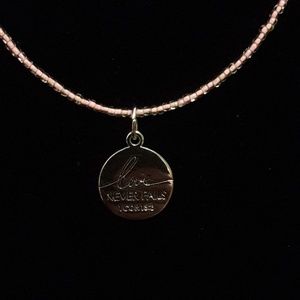 Love Never Fails charm